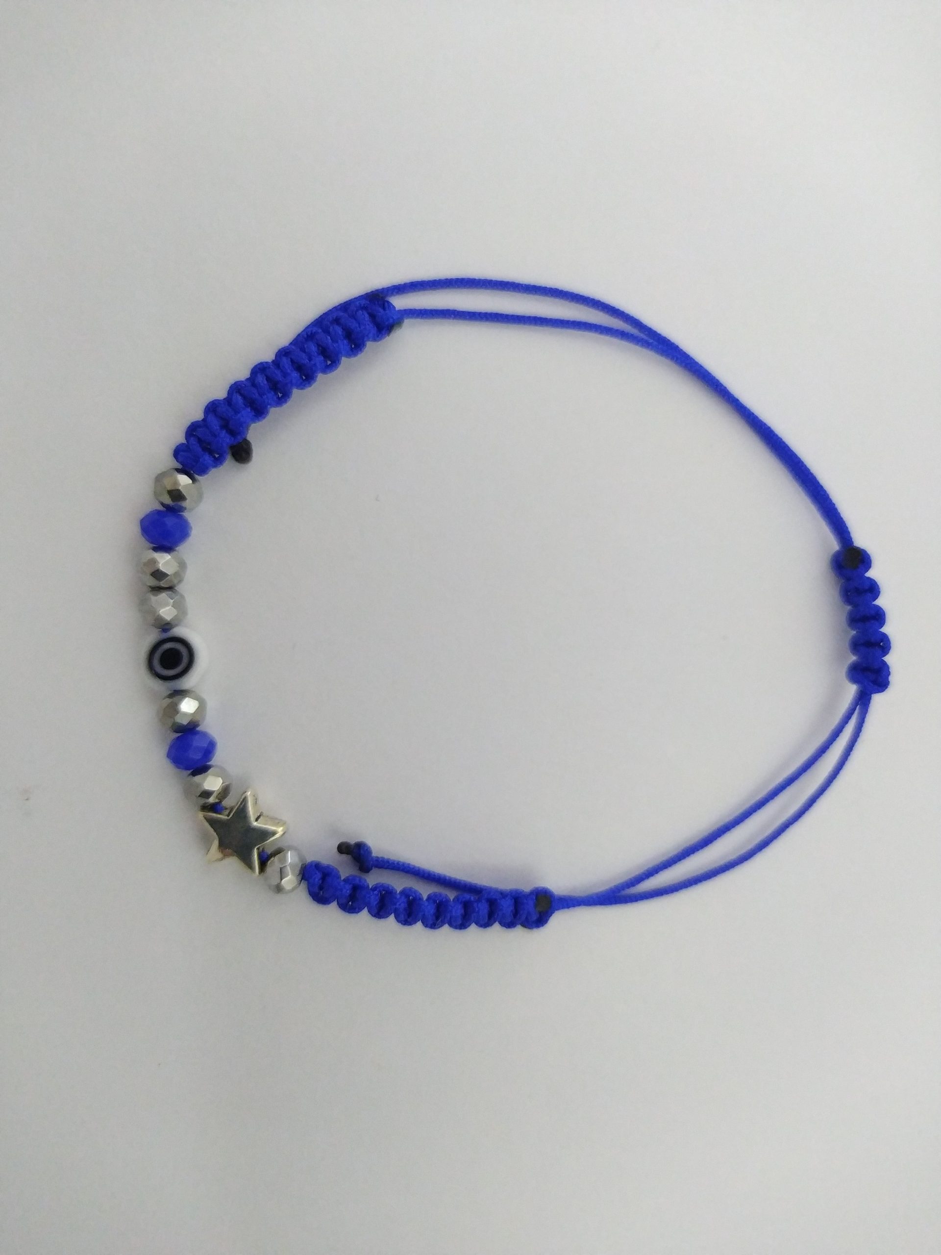 Pulsera de hilo ojito y estrellita