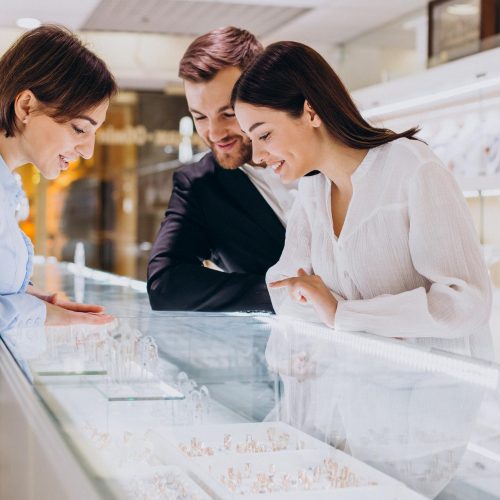 couple-at-jewelry-shop-choosing-necklace-together.jpg